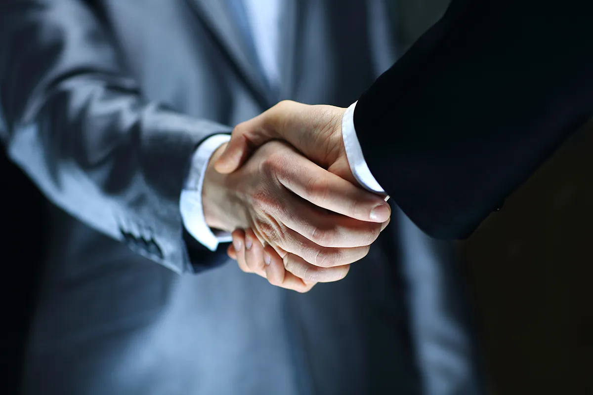 Handshake on black background | Atlantic Finance Partners Limited